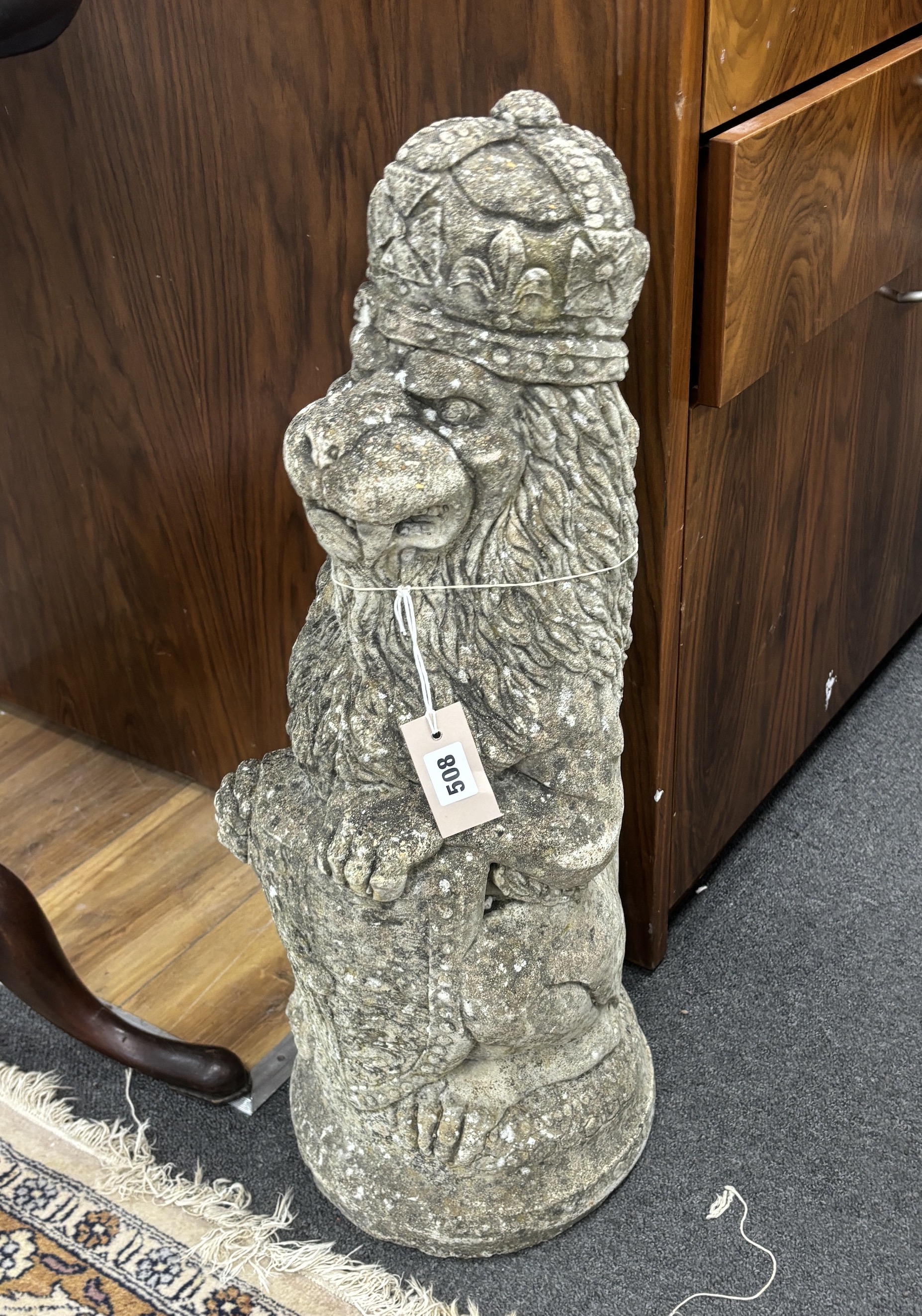 A reconstituted stone lion, 69cm high